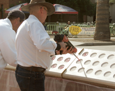 Adhesive being placed in the wall cutouts for the medallions. About $175,000 in private donations were raised to fund the memorial project.
