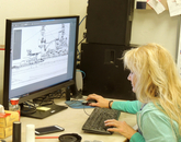 UA graphic artist Jennie Norris works on renderings of the memorial. UA graphic artist Jennie Norris works on renderings of the memorial.