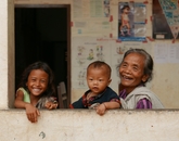 Erin Galligan, a graduate student studying nursing, takes a photo of a great grandmother and her family during the Nurse Anesthesia program in Laos, Cambodia. Erin Galligan, a graduate student studying nursing, takes a photo of a great grandmother and her family during the Nurse Anesthesia program in Laos, Cambodia.