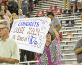 A number of guests made signs to honor graduating students. A number of guests made signs to honor graduating students.