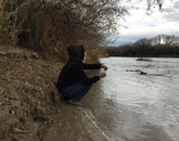 Karletta Chief samples San Juan river water. Karletta Chief samples San Juan river water.