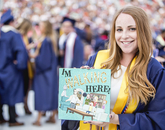 Kira Baum, who graduated with a marketing degree, shows off her mortar board, which she decorated with characters from the popular show "Rick and Morty." Baum, who was a personality on KAMP student radio, plans to work in the music industry. Kira Baum, who graduated with a marketing degree, shows off her mortar board, which she decorated with characters from the popular show "Rick and Morty." Baum, who was a personality on KAMP student radio, plans to work in the music industry.