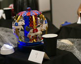 This pumpkin, crafted to look like a red and blue carousel, took first place in the Office of the Provost's pumpkin-crafting contest. The contest raised $405 for United Way of Tucson and Southern Arizona. (Photo: Kyle Mittan/University Communications) A carved pumpkin decorated as a red and blue carousel.