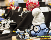 This pumpkin, decorated as a Smurf, took first place in the Office of the Provost's pumpkin-crafting contest. (Photo: Kyle Mittan/University Communications) A pumpkin crafted to resemble a Smurf and surrounded by Smurf figurines.