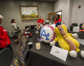 This pumpkin was crafted to resemble a baseball adorned with the LA Dodgers logo, presented next to an anthropomorphized hotdog. (Photo: Kyle Mittan/University Communications)