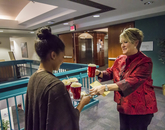 Allison Vaillancourt, vice president for business affairs and human resources, takes a root beer float from a tray carried by Nicole Johnson, an administrative associate for Human Resources. (Photo: Kyle Mittan/University Communications)