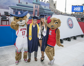 Graduates take a moment to pose with Wilbur and Wilma Wildcat. Graduates take a moment to pose with Wilbur and Wilma Wildcat.