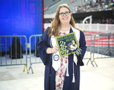 Taylor Brestle, who graduated with a degree in journalism, decorated her cap with an ogre pun. Taylor Brestle, who graduated with a degree in journalism, decorated her cap with an ogre pun.