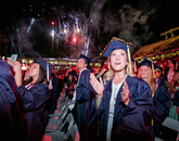 Anabelle Baggs, who graduated with a Bachelor of Science from the College of Agriculture and Life Sciences, enjoys the fireworks. Baggs, who majored environmental sciences, is planning on going to graduate school. Anabelle Baggs, who graduated with a Bachelor of Science from the College of Agriculture and Life Sciences, enjoys the fireworks. Baggs, who majored environmental sciences, is planning on going to graduate school.