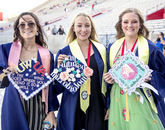 Customized mortarboards are a must for Rachel Radeka, a public health graduate going to nursing school; Sammi Meyer, a microbiology graduate headed to pharmacy school; and Haley Evans, a microbiology graduate planning to become a pathologist's assistant. (Photo: John de Dios/UANews) Customized mortarboards are a must for Rachel Radeka, a public health graduate going to nursing school; Sammi Meyer, a microbiology graduate headed to pharmacy school; and Haley Evans, a microbiology graduate planning to become a pathologist's assistant. (Photo: John de Dios/UANews)