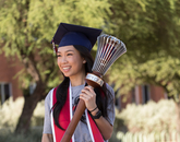 An Luu, a senior graduating with a degree in physiology, poses with the university's ceremonial mace during filming for the virtual 2020 Commencement. (Photo: Chris Richards/University of Arizona) An Luu, a senior graduating with a degree in physiology, poses with the university's ceremonial mace during filming for the virtual 2020 Commencement. (Photo: Chris Richards/University of Arizona)