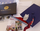 In preparation for the virtual ceremony, thousands of graduates opted to receive kits that included mortarboards, tassels and a diploma cover or a notepad and pen, along with a note from the president and provost congratulating graduates on their accomplishments. (Photo: Chris Richards/University of Arizona) In preparation for the virtual ceremony, thousands of graduates opted to receive kits that included mortarboards, tassels and a diploma cover or a notepad and pen, along with a note from the president and provost congratulating graduates on their accomplishments. (Photo: Chris Richards/University of Arizona)