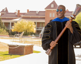 Bryan Carter, associate professor of Africana studies and director of the UArizona Center for Digital Humanities, poses with the university's ceremonial mace during filming for the virtual 2020 Commencement. (Photo: Chris Richards/University of Arizona) Bryan Carter, associate professor of Africana studies and director of the UArizona Center for Digital Humanities, poses with the university's ceremonial mace during filming for the virtual 2020 Commencement. (Photo: Chris Richards/University of Arizona)