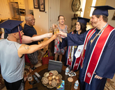 Lauren Easter (second from right), this year's Provost Award winner, celebrates with her partner and fellow graduate Zachary Stout (right) and family and friends. (Photo: Chris Richards/University of Arizona) Lauren Easter (second from right), this year's Provost Award winner, celebrates with her partner and fellow graduate Zachary Stout (right) and family and friends. (Photo: Chris Richards/University of Arizona)