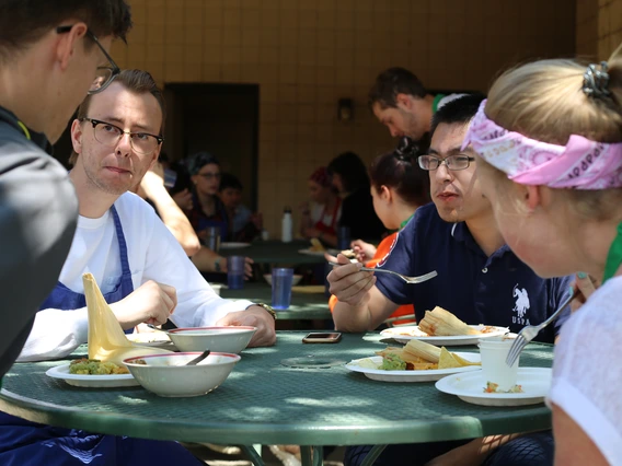 UA students and peers from the Moscow University for the Humanities share a meal they prepared together, combining Russian dishes and traditional Sonoran food. 