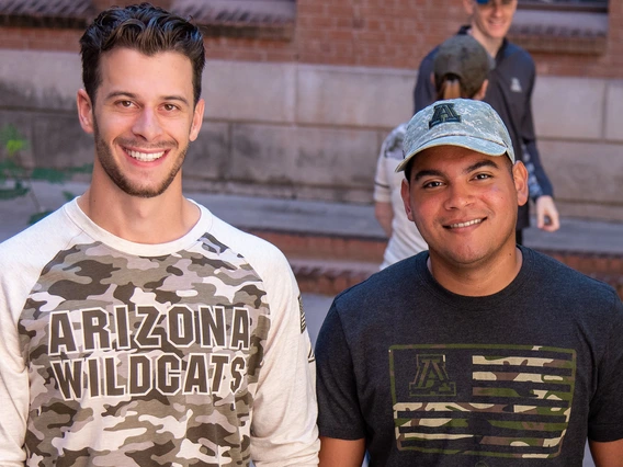 Student veterans John Krause and Manny Alberto Matias modeled Operation Hat Trick merchandise to support military servicemembers and veterans.