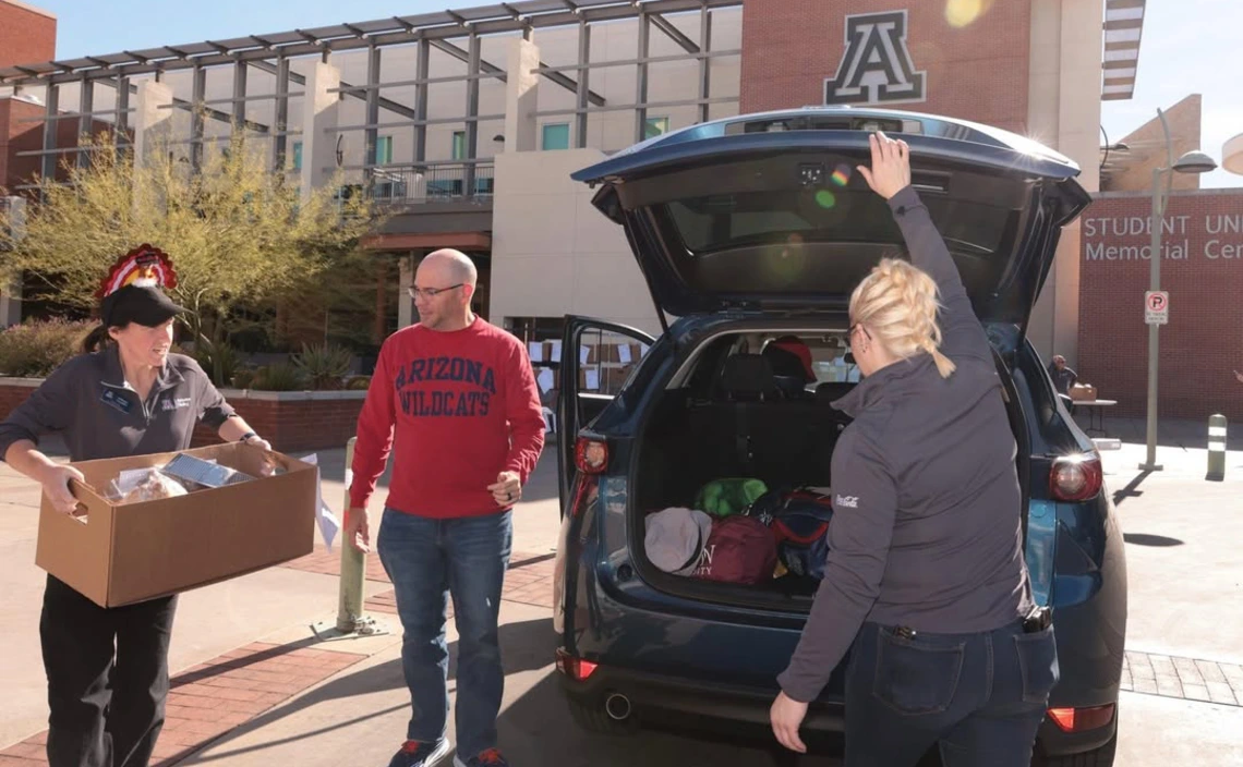 2023 Thanksgiving Dinner To-Go order distribution in the Student Union Memorial Center traffic circle.