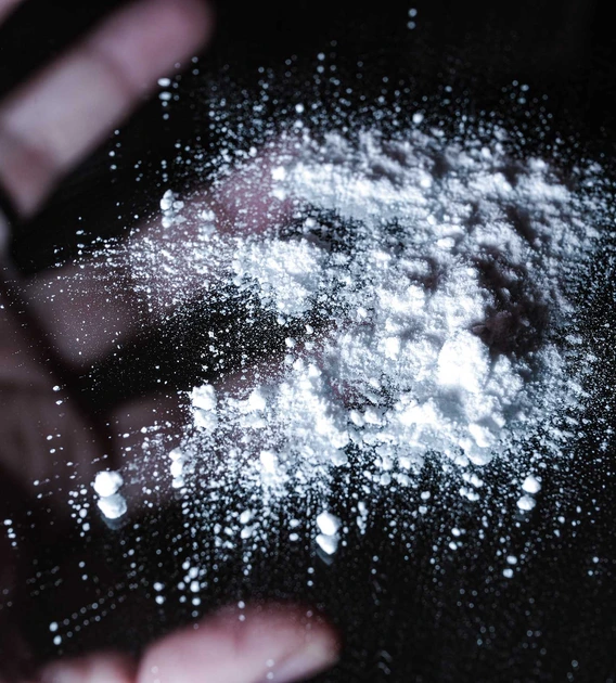 White opioid powder on glass