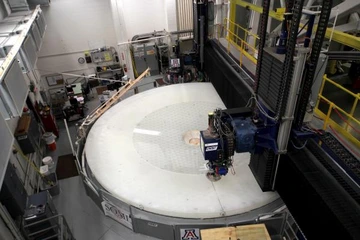 The primary/tertiary mirror of the Vera C. Rubin Telescope on the large polishing machine at the Richard F. Caris Mirror Lab