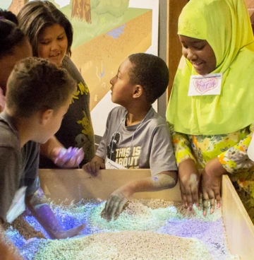 children explore an exhibit The Augmented Reality Watershed display – a favorite component of the "Welcome to the Critical Zone" exhibit at Flandrau Science Center & Planetarium – is part of the broader impacts plan for the "Transformative Behavior of Energy, Water and Carbon in the
