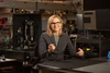 Jennifer Barton in a lab holding an ovarian cancer detection falloposcope