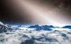 Exozodiacal dust is depicted as a white, glowing haze above the mountainous horizon of a hypothetical exoplanet in this artist's depiction. 