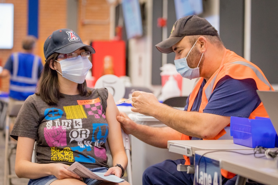 young woman getting vaccinated