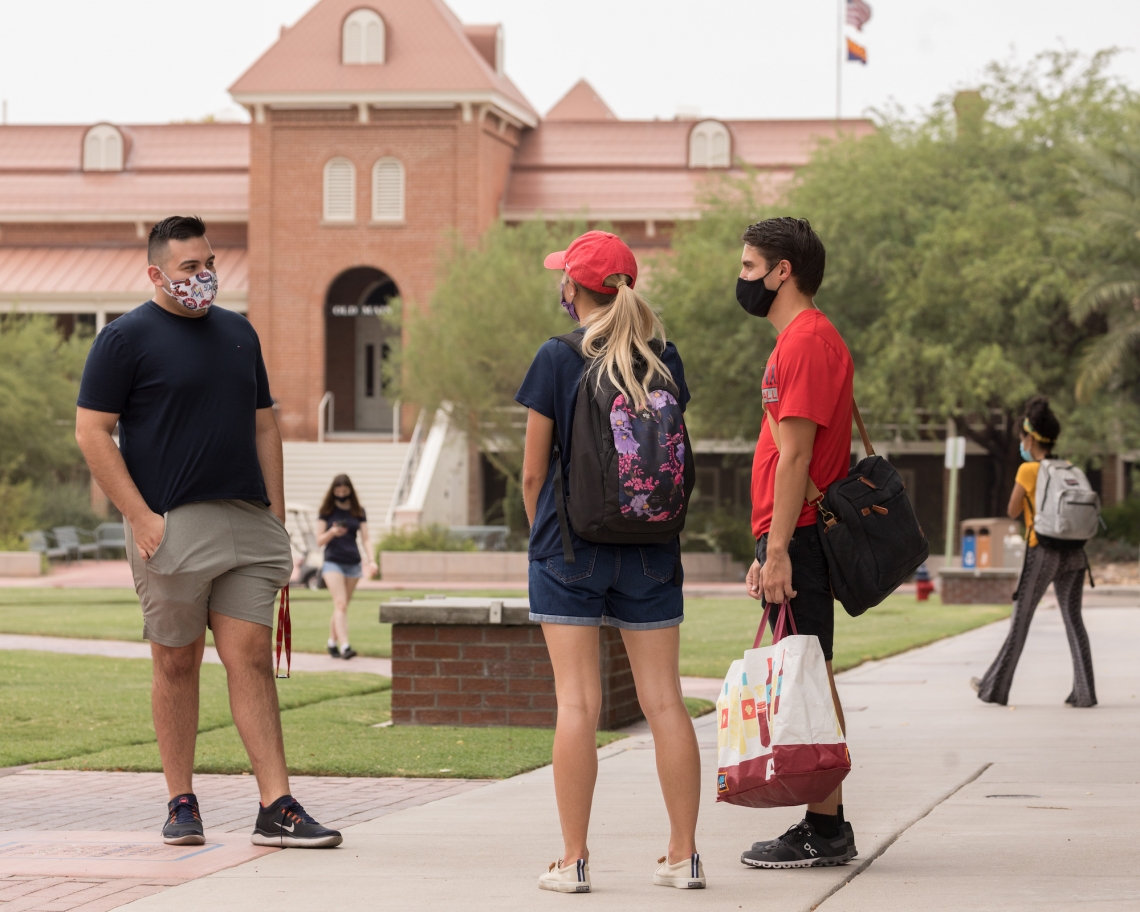 students wear masks on campus