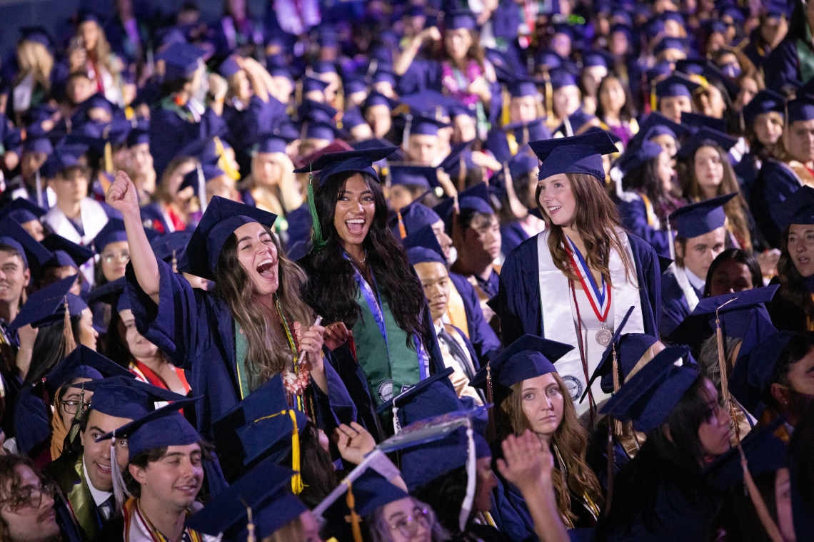 graduates celebrate during commencement