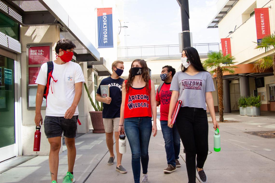 students walking together wearing masks