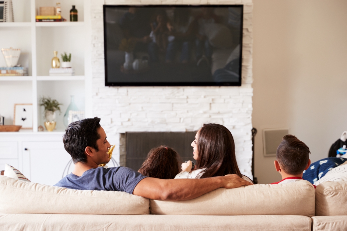 couple on couch watching tv