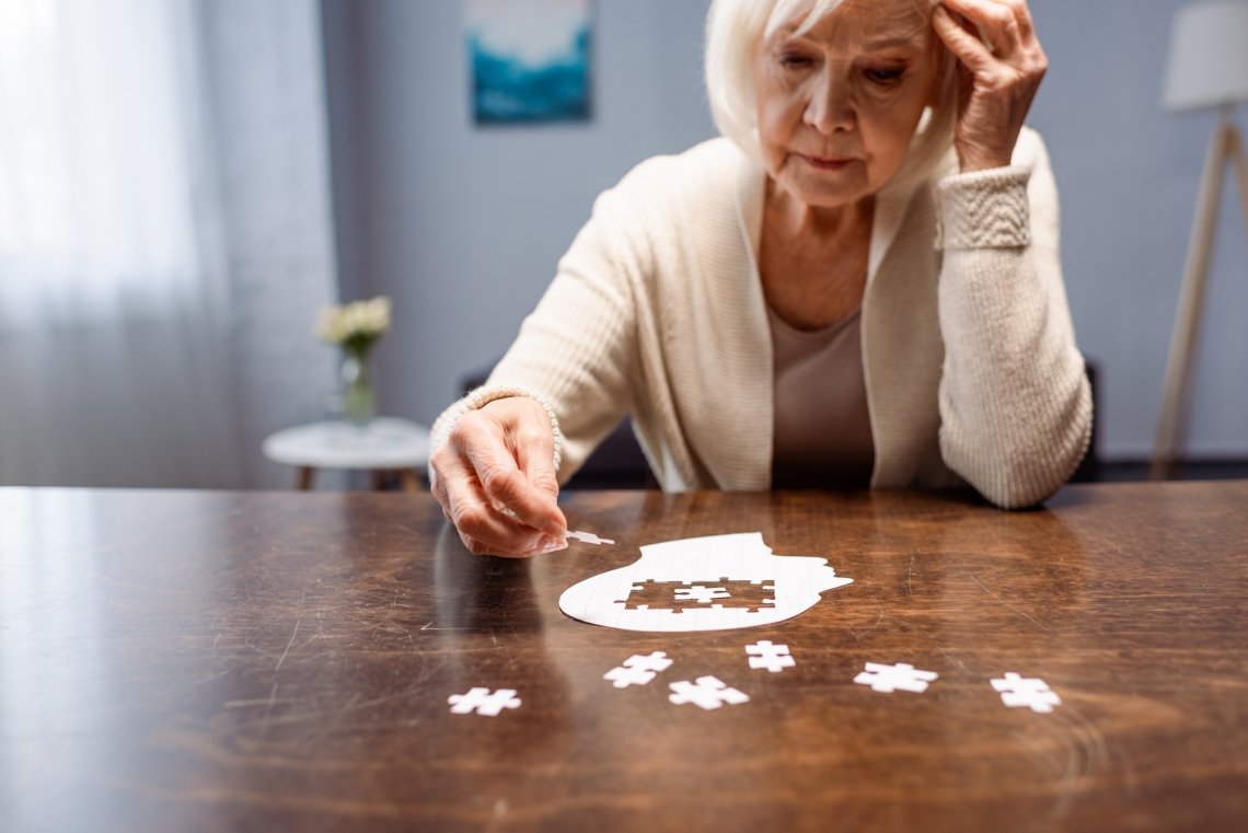 woman completing a puzzle