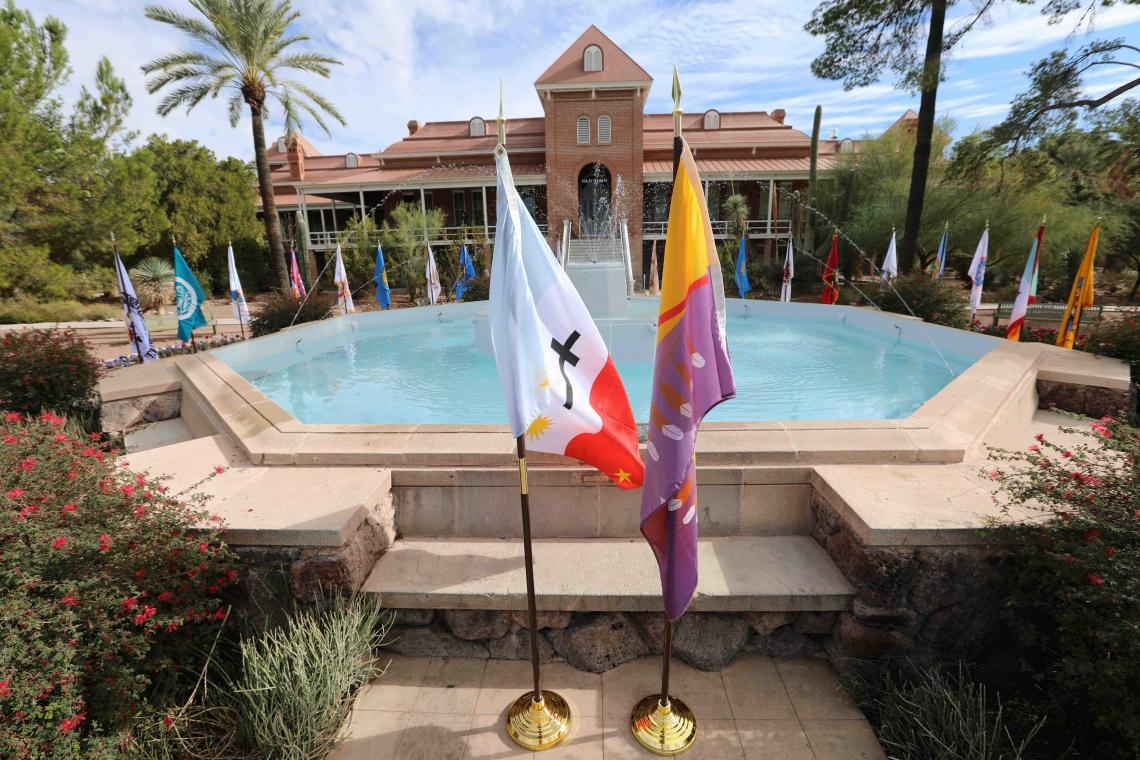 Native American flags around the fountain at Old Main