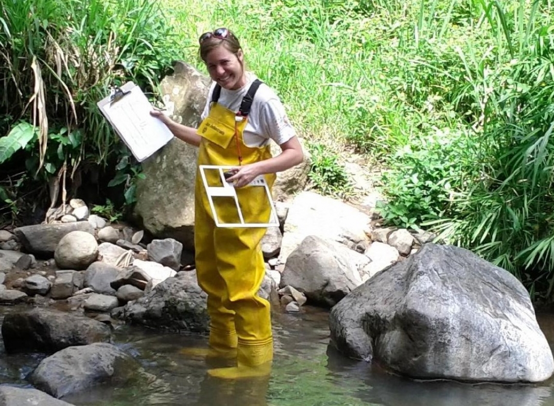 Woman standing in shallow water