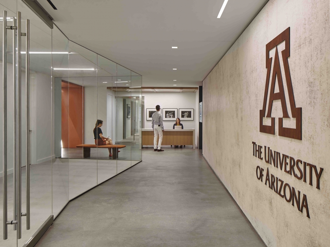 office hallway with a desk at the end