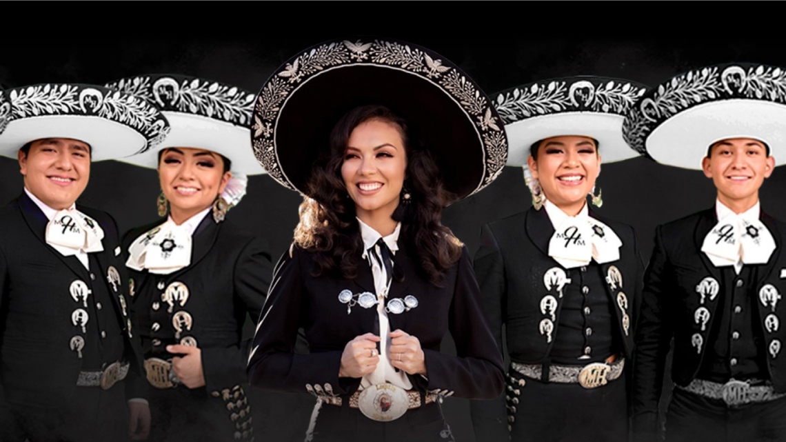 Mariachi Herencia de Mexico and Lupita Infante Lupita Infante flanked by members from Mariachi Herencia de Mexico