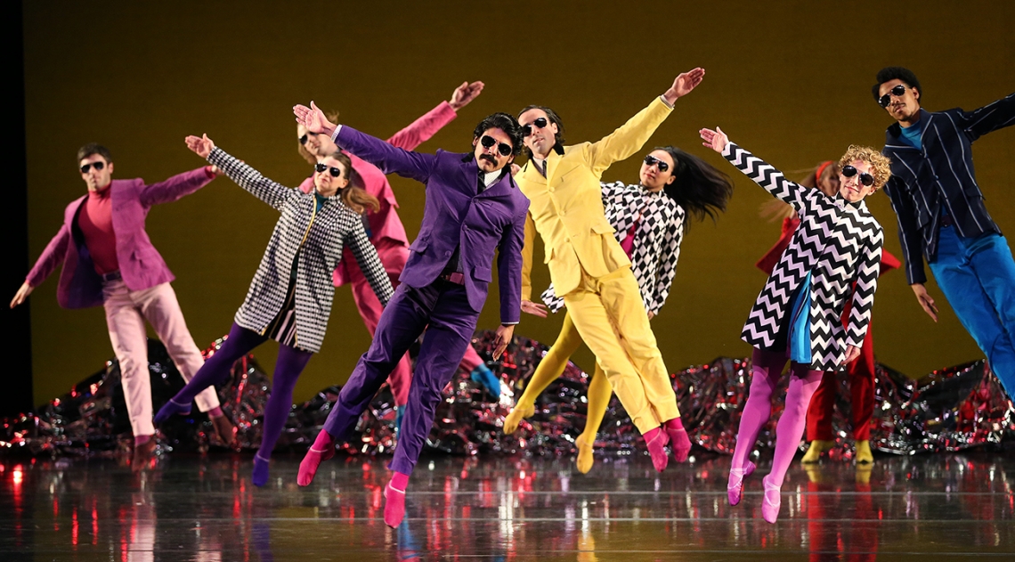 people in colorful outfits dancing
