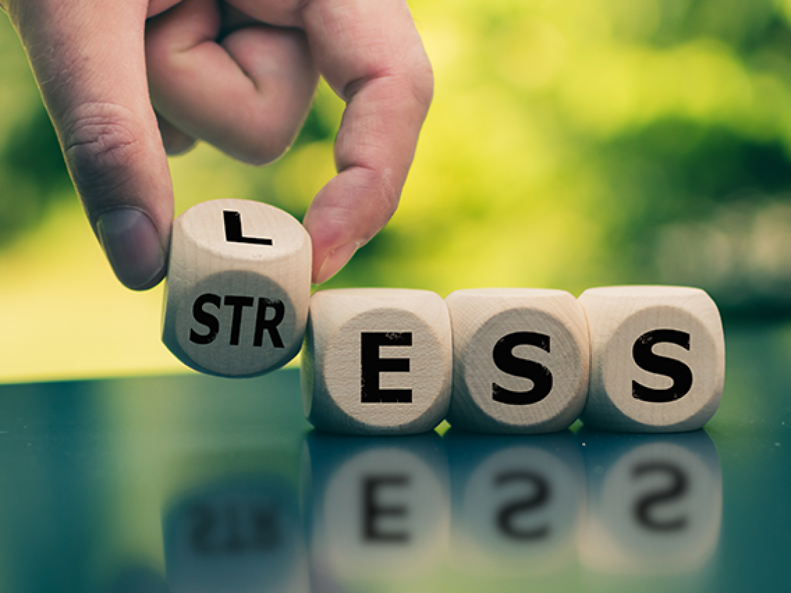 Wooden box spelling stress.