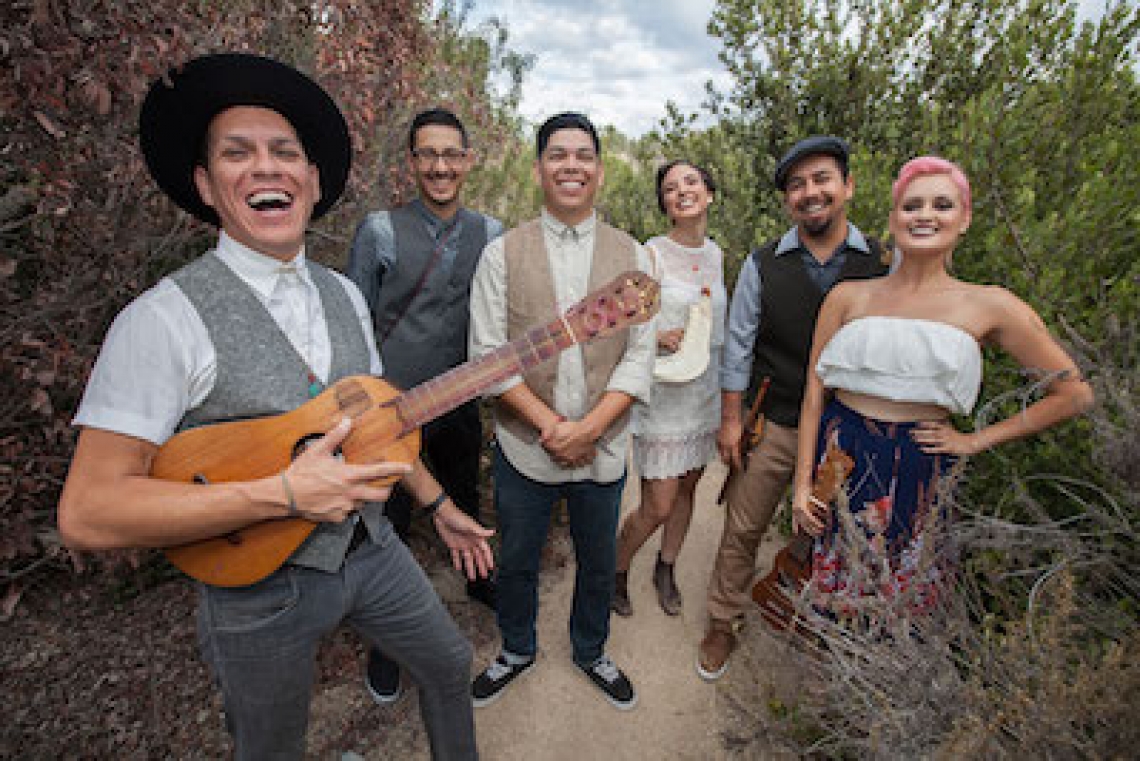 six people holding musical instruments