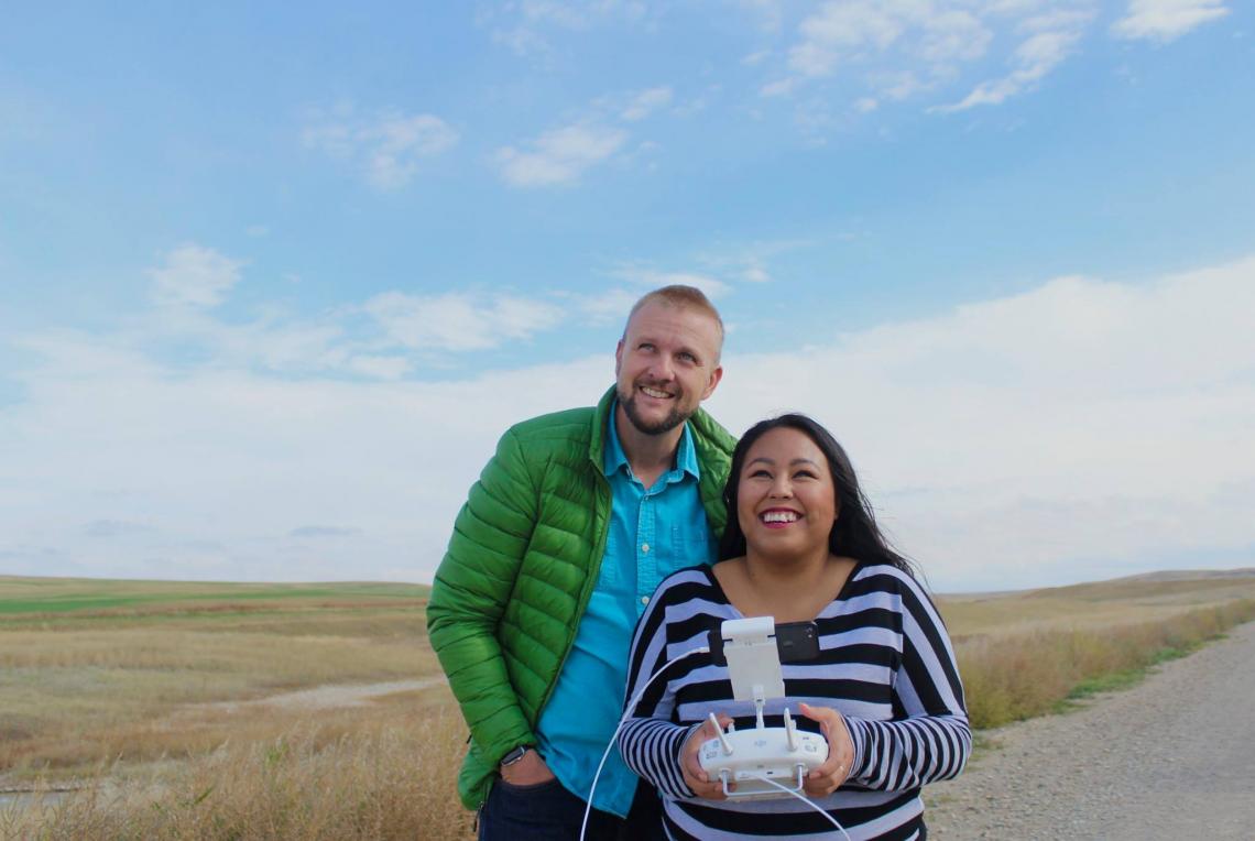 Journalism assistant professor of practice Mike McKisson and journalism student Maritza Dominguez fly a drone in Montana along the U.S.-Canada border. Students are learning how to use digital and drone technologies to report on important cultural and soci Journalism assistant professor of practice Mike McKisson and journalism student Maritza Dominguez fly a drone in Montana along the U.S.-Canada border. Students are learning how to use digital and drone technologies to report on important cultural and soci