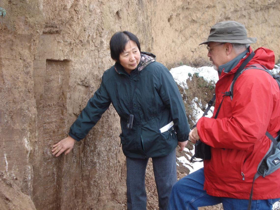 Weijian Zhou of the Chinese Academy of Sciences in Xi’an and Warren Beck of the University of Arizona at a cross-section of a hill near Xi’an, China, examining layers of loess soil that represent thousands of years of soil deposition. Weijian Zhou of the Chinese Academy of Sciences in Xi’an and Warren Beck of the University of Arizona at a cross-section of a hill near Xi’an, China, examining layers of loess soil that represent thousands of years of soil deposition.
