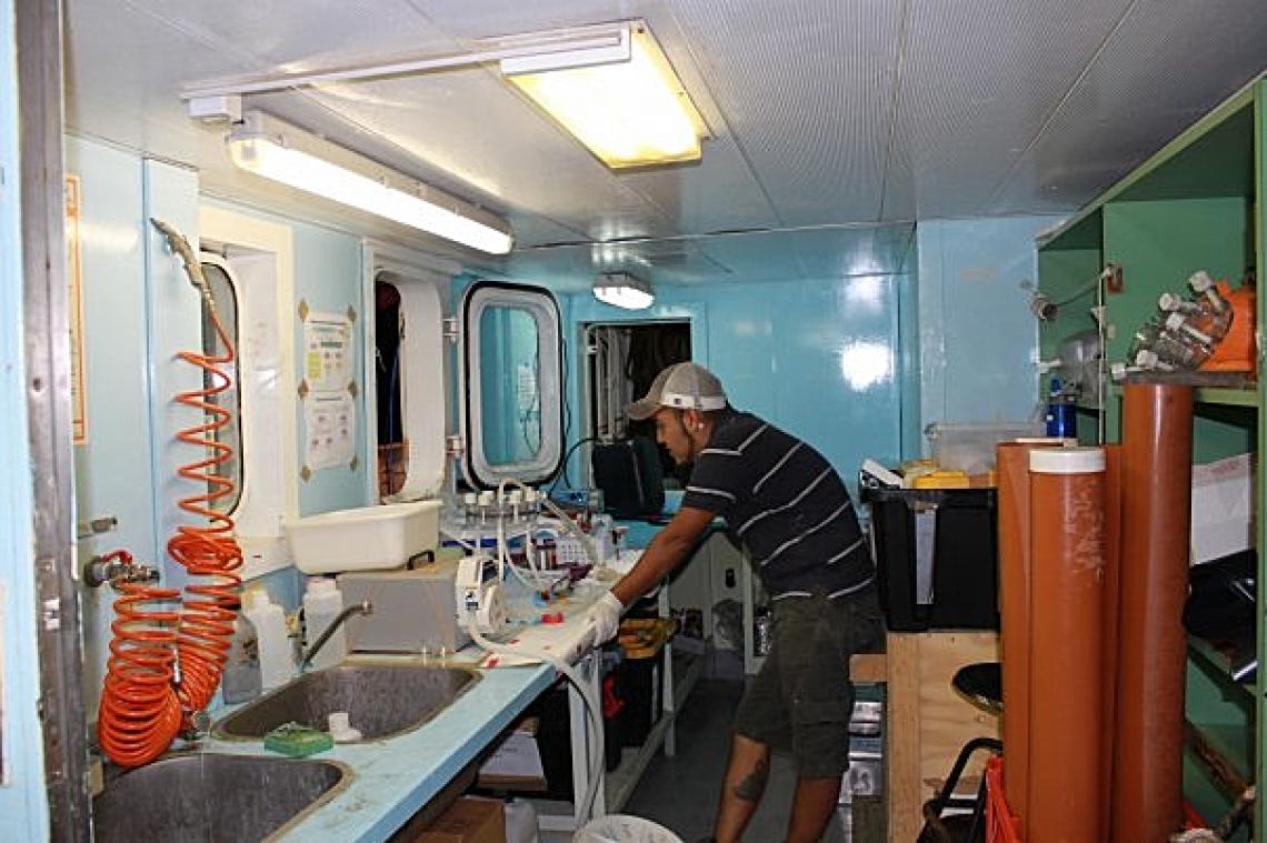 J. Cesar Ignacio Espinoza, a UA doctoral student in Sullivan's lab and co-first author on the Nature paper, in a mobile lab set up on a research cruise to sample viruses in the ocean. J. Cesar Ignacio Espinoza, a UA doctoral student in Sullivan's lab and co-first author on the Nature paper, in a mobile lab set up on a research cruise to sample viruses in the ocean.