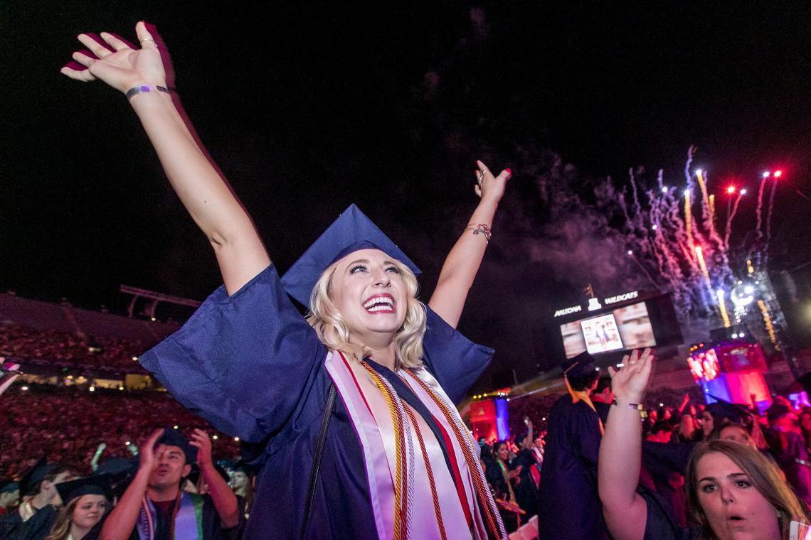 Katie Alhadeff, a business management graduate, celebrates at the close of the Commencement ceremony. Katie Alhadeff, a business management graduate, celebrates at the close of the Commencement ceremony.