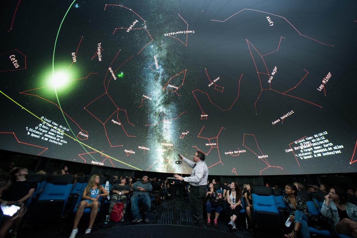 Tom Fleming teaches an astronomy class in the FullDome theater at Flandrau Science Center and Planetarium. 