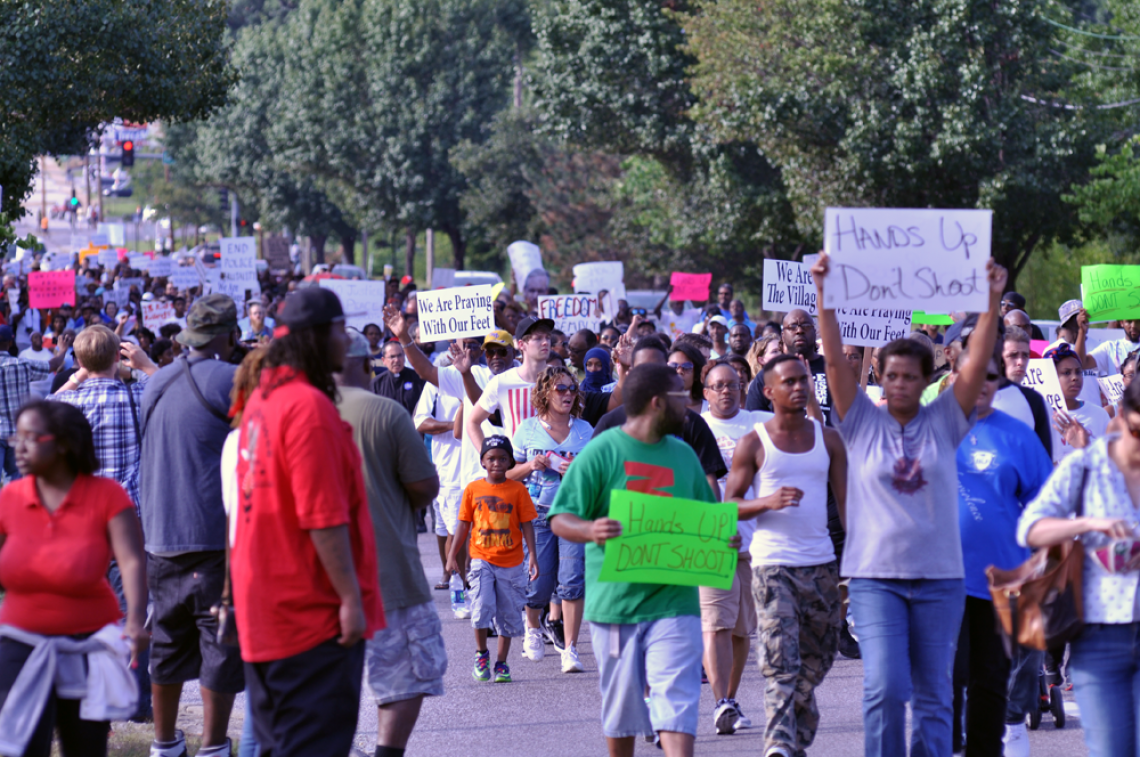Protesters march in the aftermath of the Aug. 9 shooting death of Michael Brown in Ferguson, Mo. Protesters march in the aftermath of the Aug. 9 shooting death of Michael Brown in Ferguson, Mo.