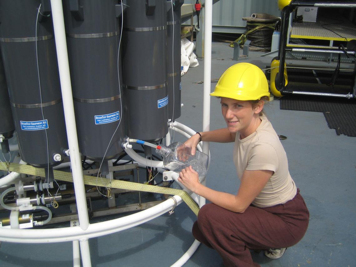 Karin Holmfeldt, the study’s first author, aboard a research vessel sampling viruses in the Atlantic Ocean. 