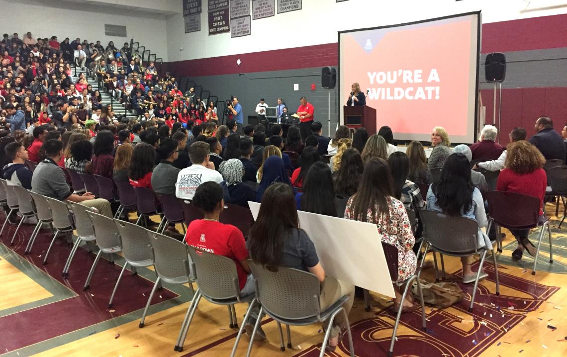 Kasey Urquidez, the UA's vice president for Enrollment Management and Student Affairs Advancement, informs a group of Desert View High School seniors that they have been accepted to the UA. 