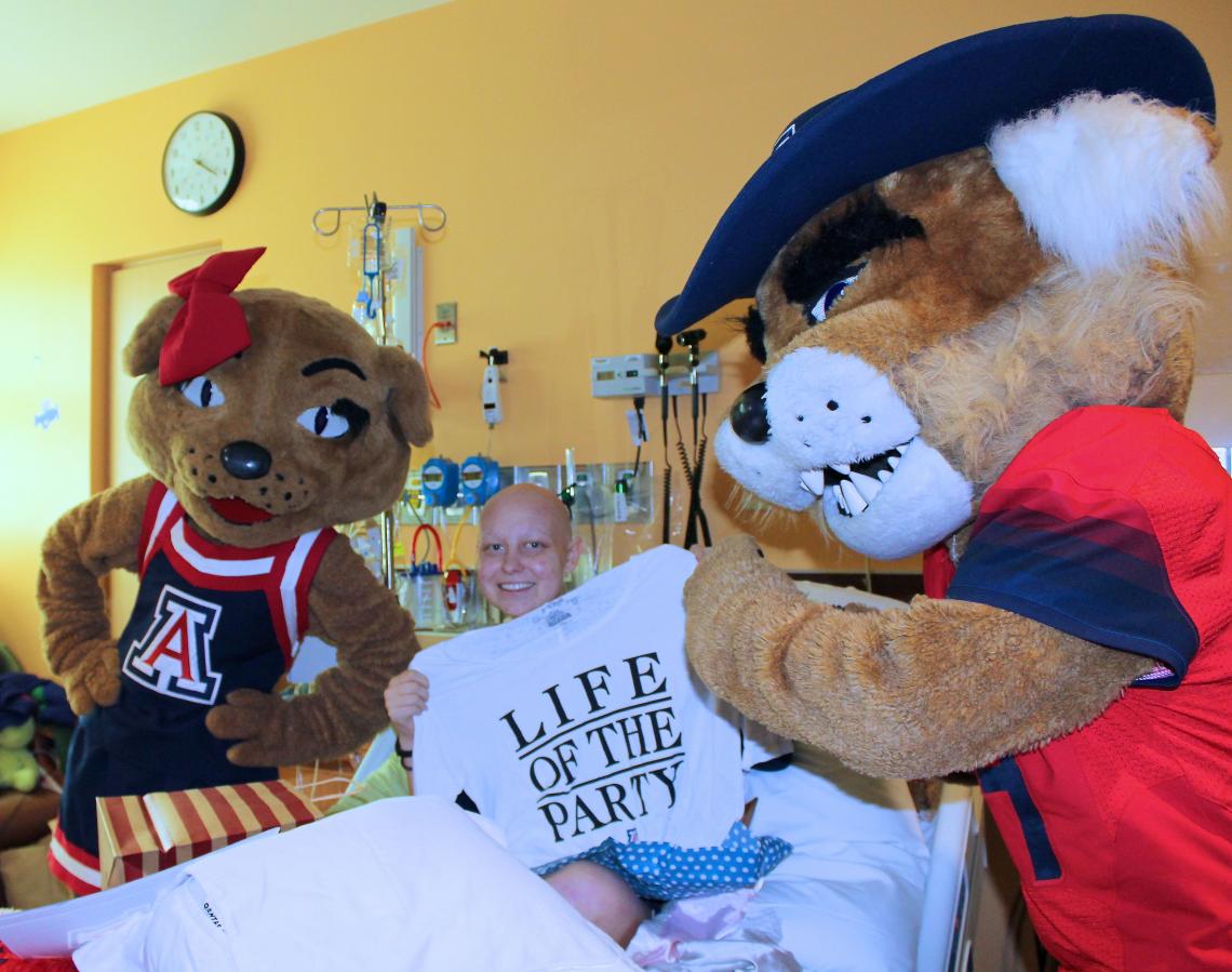 Friends and family had to keep the surprise UA acceptance announcement a secret from Kelsey Luria, waiting for a time it for when she was feeling well enough. Luria was dressed for the occasion, however, as her hospital floor had instituted a "Bear Down T Friends and family had to keep the surprise UA acceptance announcement a secret from Kelsey Luria, waiting for a time it for when she was feeling well enough. Luria was dressed for the occasion, however, as her hospital floor had instituted a "Bear Down T