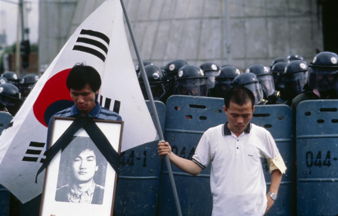 South Korean students hold a photograph of Lee Han-yeol, a student who was killed during the South Korean democracy movement in 1987. South Korean students hold a photograph of Lee Han-yeol, a student who was killed during the South Korean democracy movement in 1987.