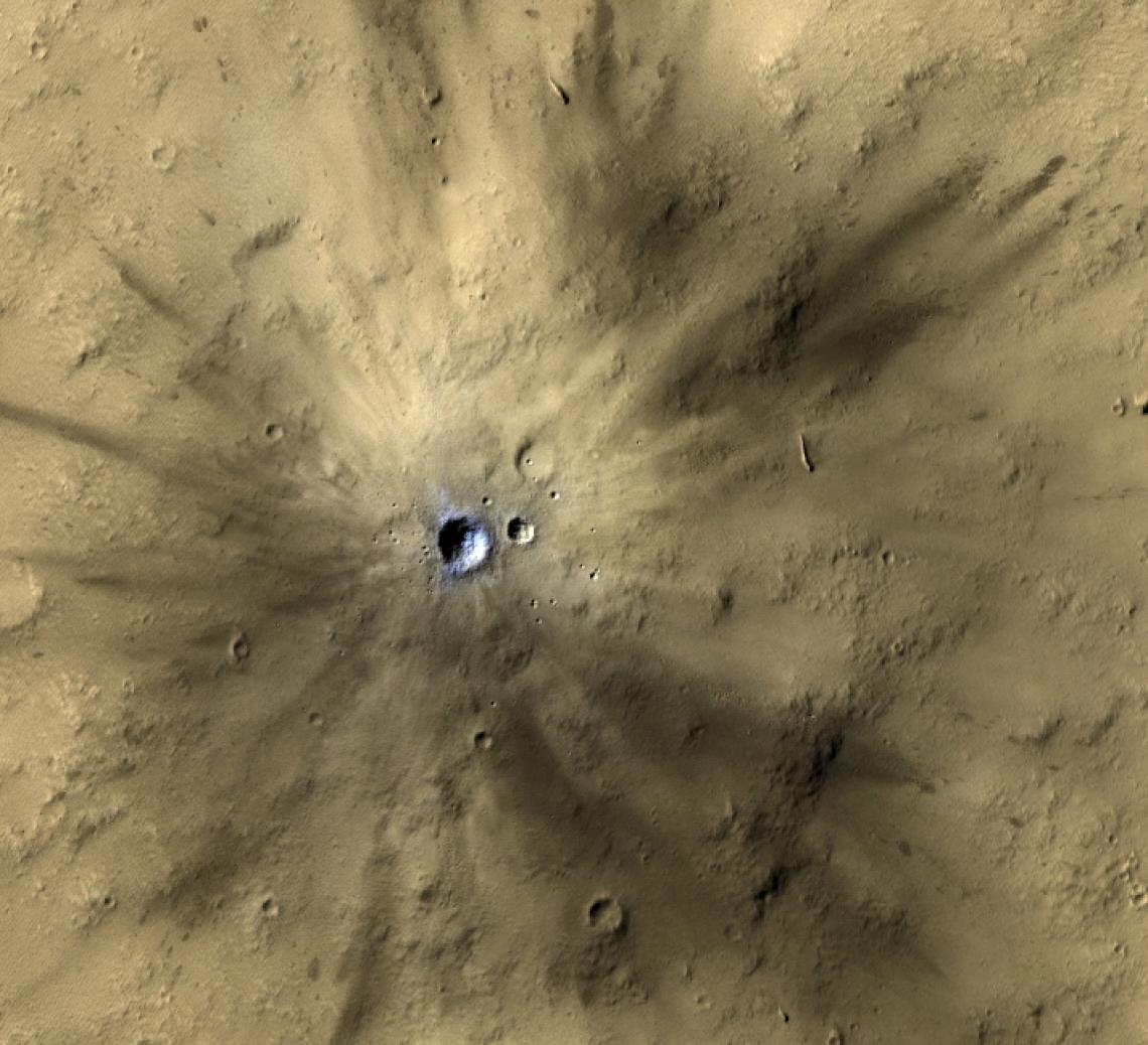One of many fresh impact craters spotted by the UA-led HiRISE camera, orbiting the Red Planet on board NASA's Mars Reconnaissance Orbiter since 2006. One of many fresh impact craters spotted by the UA-led HiRISE camera, orbiting the Red Planet on board NASA's Mars Reconnaissance Orbiter since 2006.